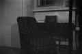 Photograph: [Chair with Desk and Mantle]