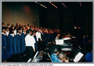 Primary view of object titled '[Choir ensemble looking at conductor]'.