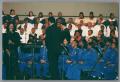 Photograph: [Tanya Blount on stage with band and choir]