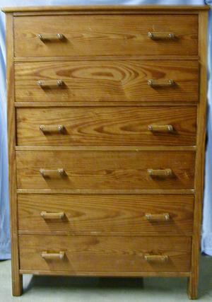 [Wood dresser with six drawers with wood handles]