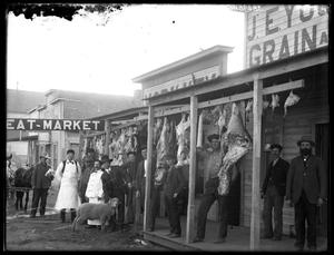 Primary view of object titled '[Portrait of Group at Meat Market]'.