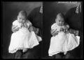 Photograph: [Child Sitting on Woman's Lap]