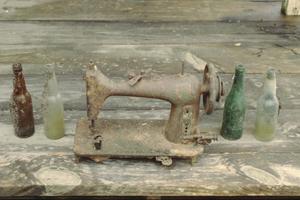 [Annie Mae Green House, (artiacts from around the house (bottles and sewing machine))]