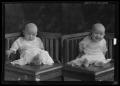 Photograph: [Two Portraits of Baby Sitting in Chair]
