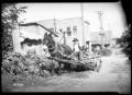 Photograph: [Photograph of a Man and a Dog on a Donkey-Drawn Cart]