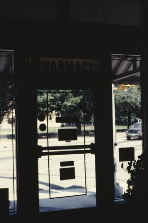 [Highland Ave Pharmacy, (interior detail, front door)]