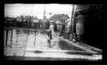 Photograph: [Photograph of a Group of People Around a Swimming Pool]