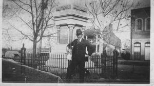 [A man standing in front of the Jaybird Monument]